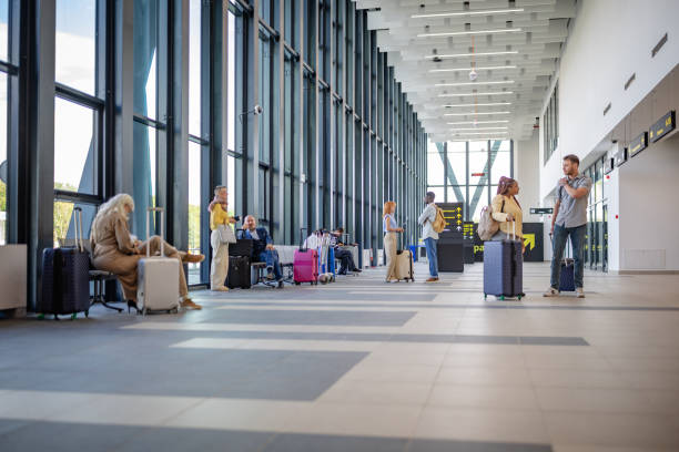 istock Busy airport terminal bustling with waiting passengers. 2184249337