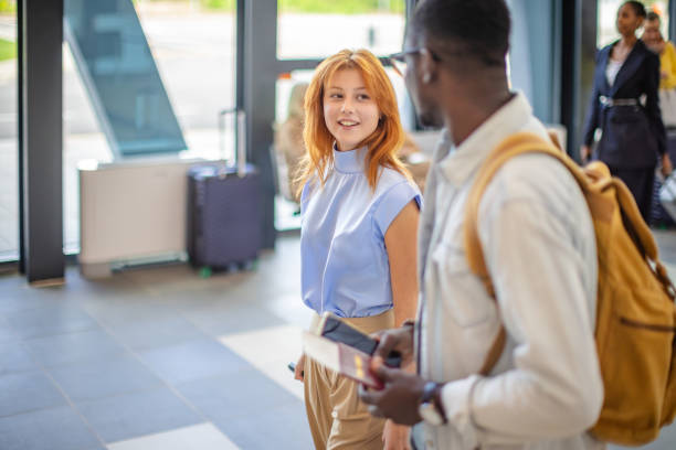 istock Candid airport moment between diverse young travelers 2184249593