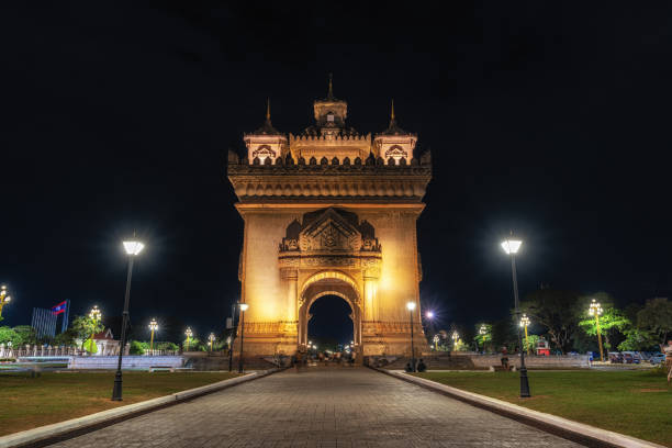 Night light view over Patuxai monument with various tourists visiting. Taken in Vientiane, Laos