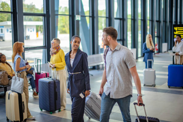 istock Travelers sharing a moment in bustling terminal hub 2184252992