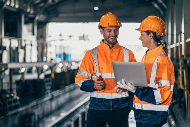 istock Engineer team man flirt women while working happy together enjoy friend relax smiling talking in industry factory. 2184255830