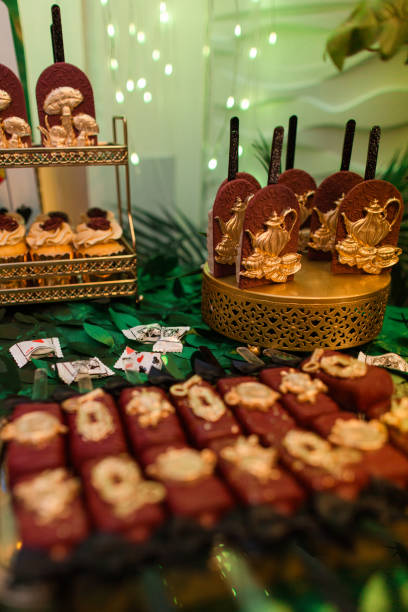 istock Festive Red & Gold Party Decorations, Table Settings & Dessert Bar 2184257987