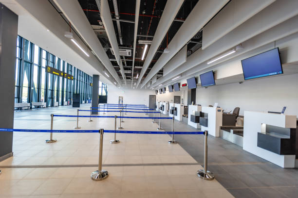 istock Wide airport check-in area with digital information screens 2184257988