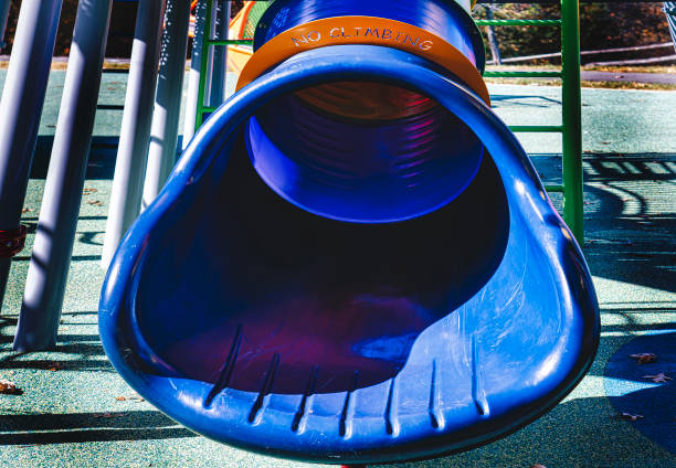 Green and red slide in a public park - Cair in the city of Nis, Serbia.