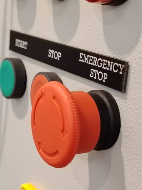 istock Close up image of emergency stop push button mounted on electrical switch board. 2184258947