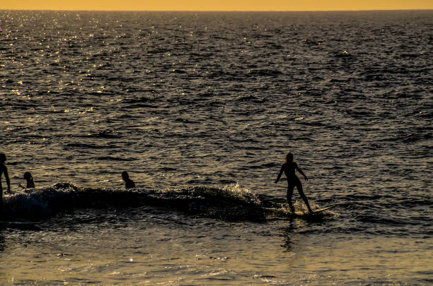 istock A man is surfing on a wave in the ocean 2184260493