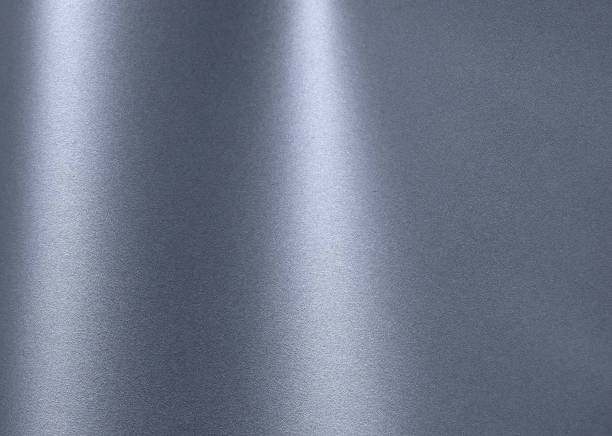 Glossy designer paper background in metallic blue gray with a smooth, satin finish. This reflective surface features a chic gradient, bright highlights, and subtle sparkle,