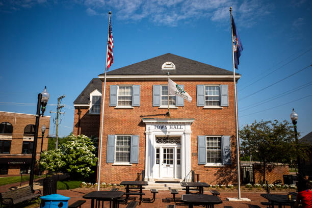 City Hall in Herndon, Virginia, with flags and blue sky. stock photo