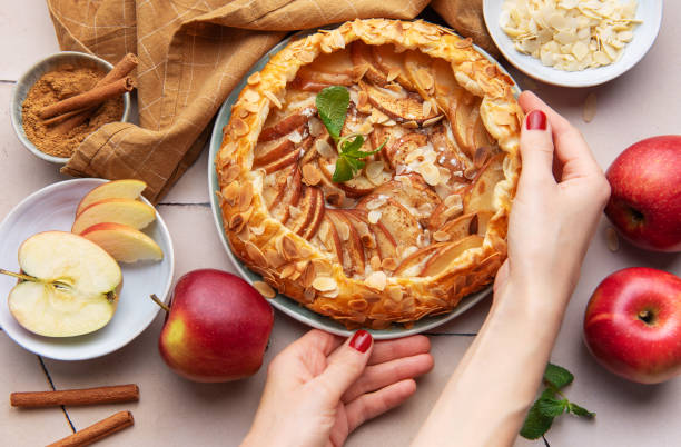 istock Apple galette preparation with fresh ingredients and spices on a kitchen countertop 2184266555