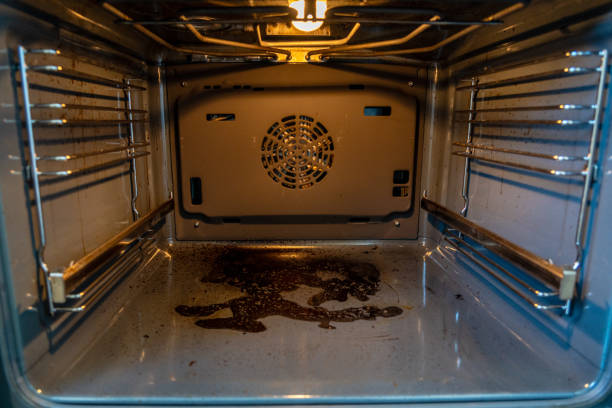 istock Close up inside view of dirty oven with deposits on bottom 2184268438