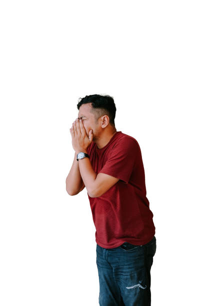 istock Man covering face in distress, isolated on white background 2184269032