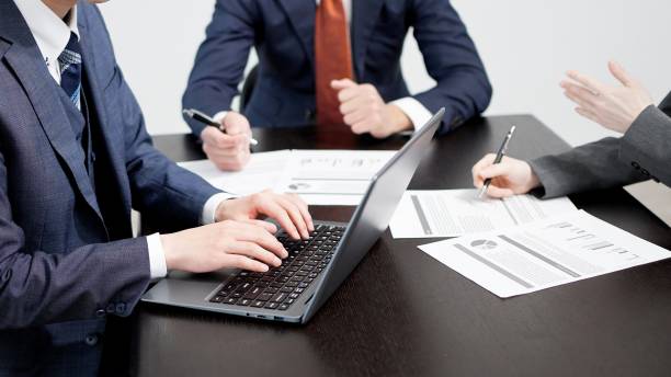 istock Business people typing in a meeting 2184269052