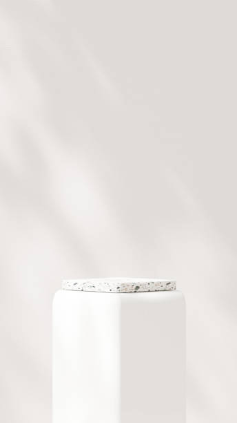 istock Background featuring an empty product display mockup with a beige backdrop and abstract geometric platforms designed for showcasing merchandise in portrait orientation. 2184270604