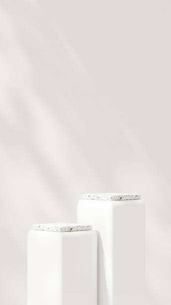 istock Background featuring an empty product display mockup with a beige backdrop and abstract geometric platforms designed for showcasing merchandise in portrait orientation. 2184270612
