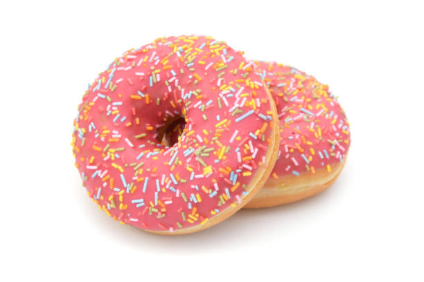 istock Pinky donuts with sugar parts sprinkled isolated on white 2184276069