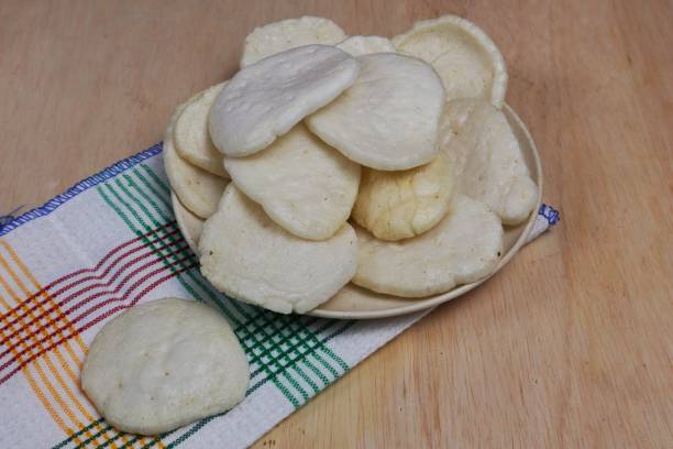 istock Fish crackers, Palembang crackers are a type of traditional Indonesian cracker originating from Palembang, Indonesia. Served on a wooden plate 2184276273
