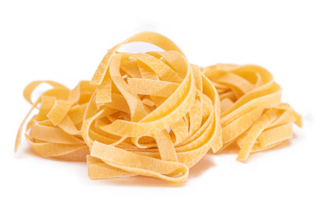 istock Four Classic Italian Raw Egg Fettuccine - Isolated on White Background 2184279732