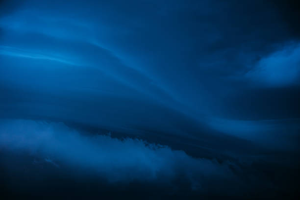 Deep blue Cloudy Sky With Dark Storm Clouds During Rain. Natural Background With Rainclouds. natural weather background dark blue color backdrop thunderstorm stormy sky.