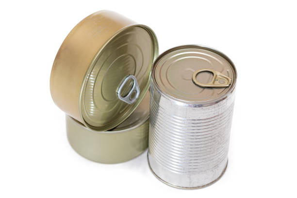 A Group of Stacked Tin Cans with Blank Edges Isolated on White Background. Canned Food. Different Aluminum Cans for Safe and Long Term Storage of Food. Steel Sealed Food Storage Containers - Isolation