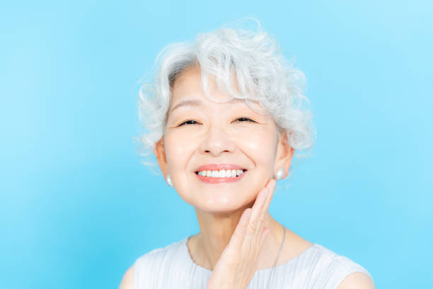istock Senior woman doing skin care 2184283028