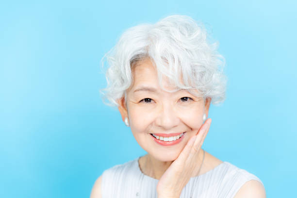 istock Senior woman doing skin care 2184283030