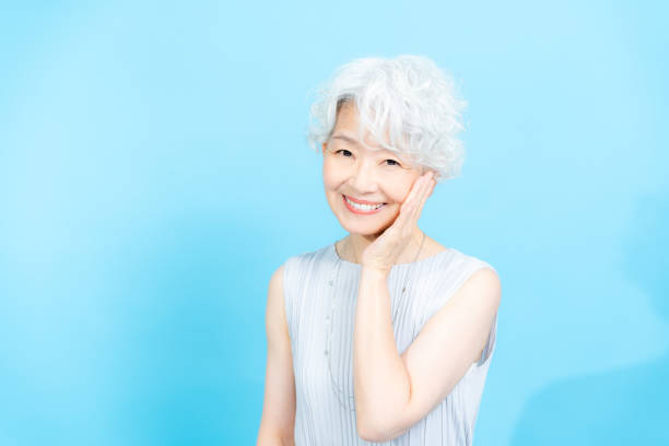 istock Senior woman doing skin care 2184283032