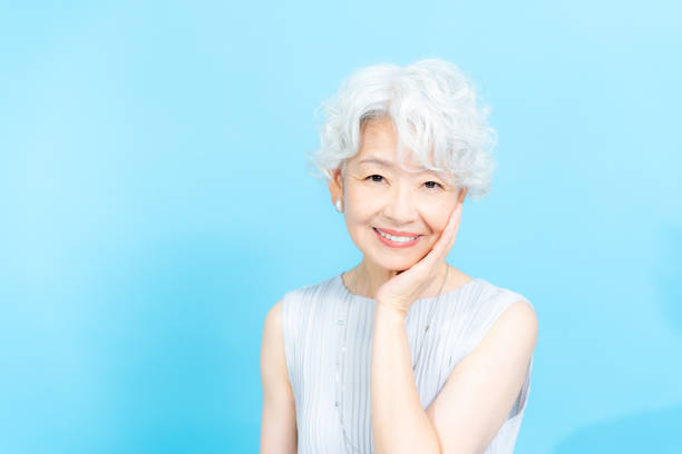 istock Senior woman doing skin care 2184283035