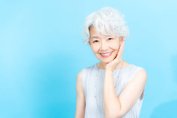 istock Senior woman doing skin care 2184283038