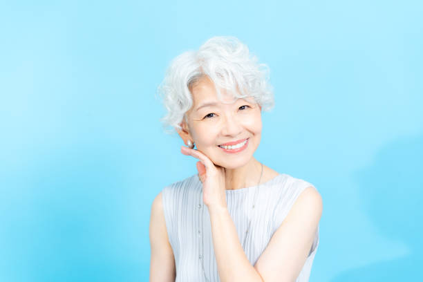 istock Senior woman doing skin care 2184283047