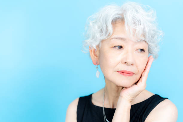 istock Senior woman doing skin care 2184283111