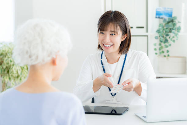 istock Pharmacist giving medicine to senior 2184283286