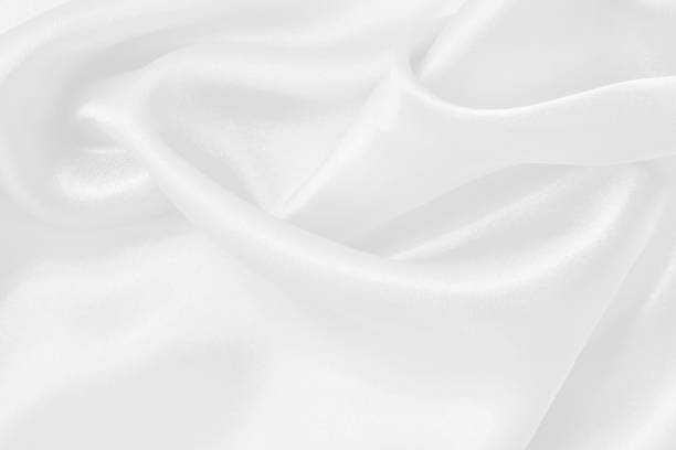istock White fabric texture for background and design, beautiful pattern of silk or linen. 2184284879
