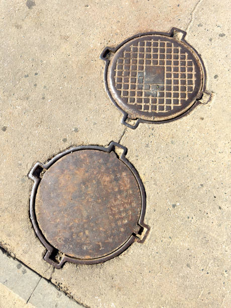 istock Two round metal pieces on the ground 2184285663