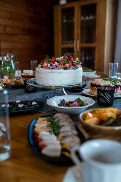 Indoor Dining Table with Festive Meal and Decorated Cake