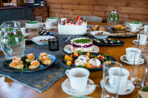 istock Indoor Dining Table with Assorted Dishes and Desserts 2184287820