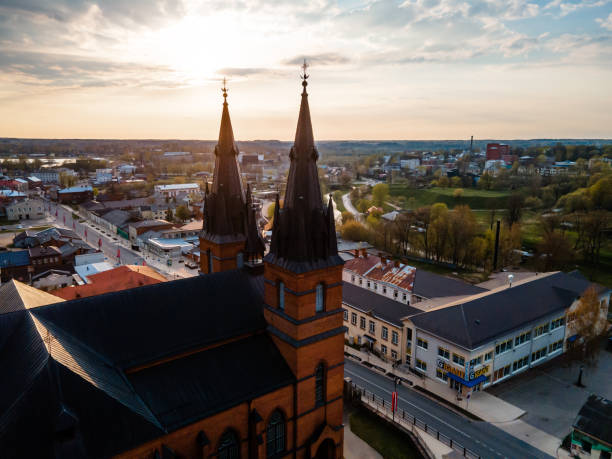 istock Brick Church with Twin Spires at Sunset in Small Town Setting 2184287877