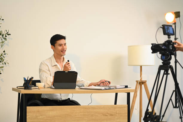 istock Confident successful businessman giving an interview for online media 2184288296