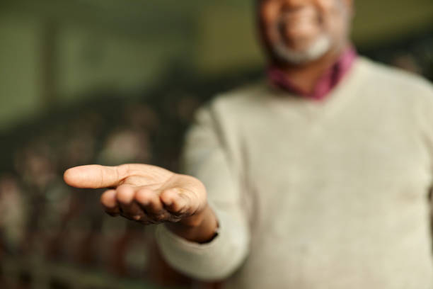 Close up of unrecognizable African American man holding open palm.
