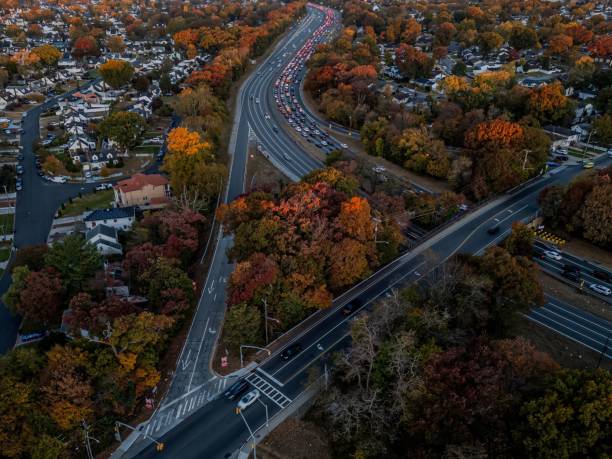 istock Aerial suburban highway with autumn foliage. 2184293531
