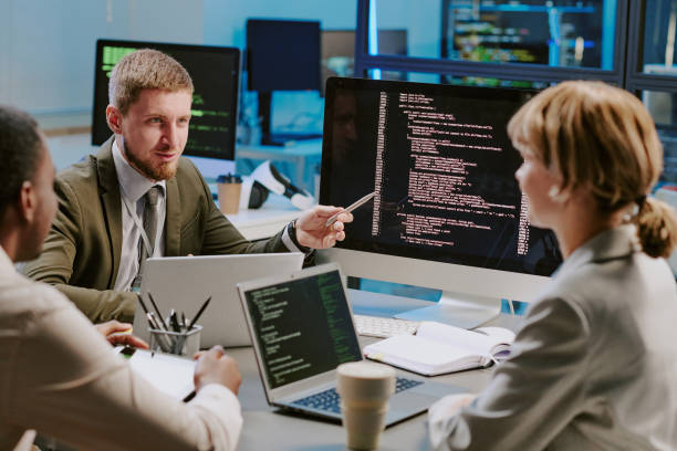 istock Group Of Data Security Specialists Having Meeting In Office 2184300828