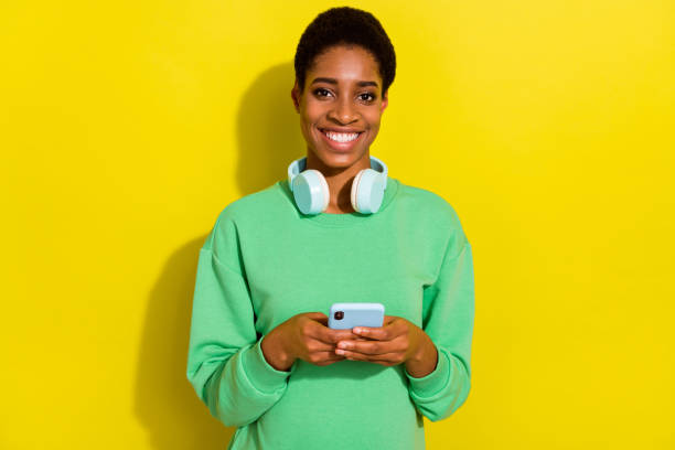 istock Photo of pretty charming short hair person dressed casual pullover typing modern device isolated yellow color background 2184300942