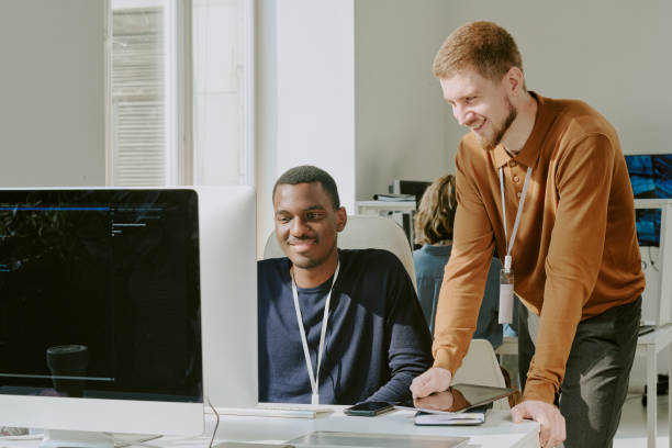 istock Cheerful Young Men Coworking in IT Office 2184301181