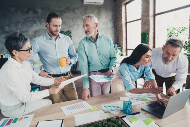 istock Photo of teamwork startup partners people brainstorming trading project comfortable nice creative startup office loft room interior 2184301998