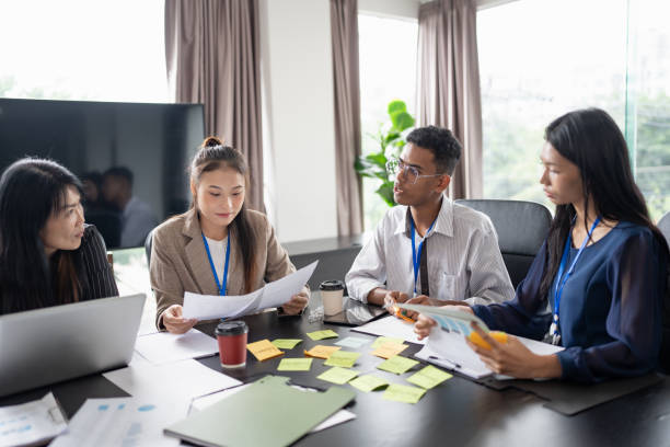 istock Business asian Multicultural businesspeople working project  working together in office conference ideas in startup at office Diversity leadership and business people 2184303949