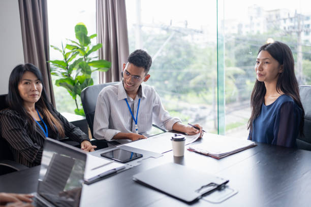 istock Examiner reading a resume during job interview at office Business and human resources concept. 2184303960
