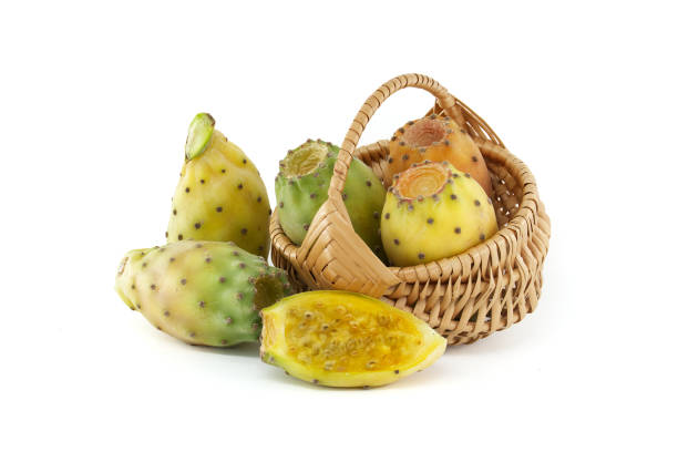 Vibrant prickly pears arranged in a wicker basket on white background, highlighting their vivid hues