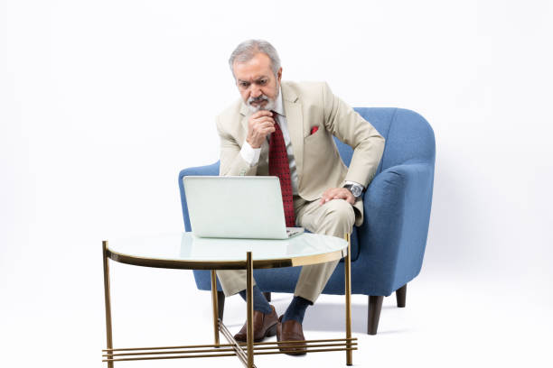 istock Senior man using laptop studio shoot stock photo 2184305706