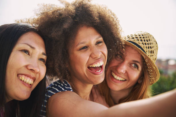 istock Mixed race female friends making a selfie 2184306295