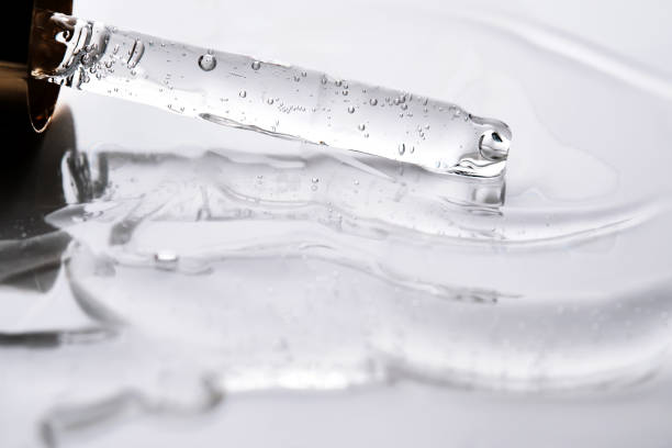 istock Dropper pipette with delicious serum with bubbles on the gel texture. 2184307329