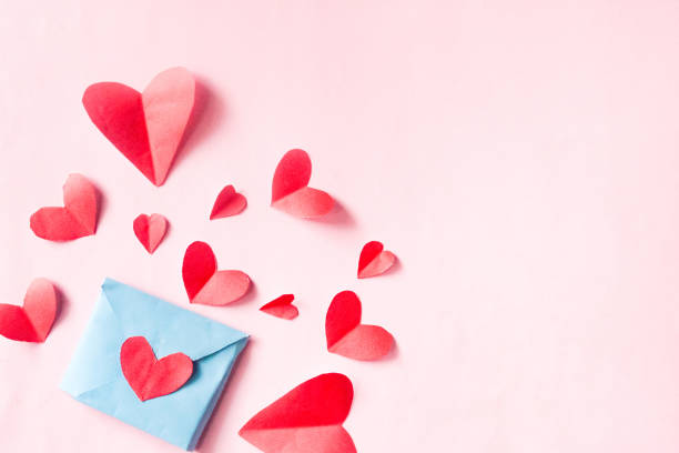 istock red paper hearts on pink background with negative space. Valentine's day background. 2184307881